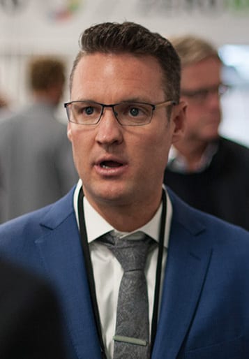 Trevor Milton in a blazer and open-collar shirt, photographed at an event in 2017
