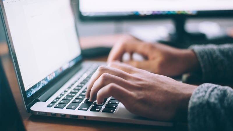 Blogging and writing on a laptop