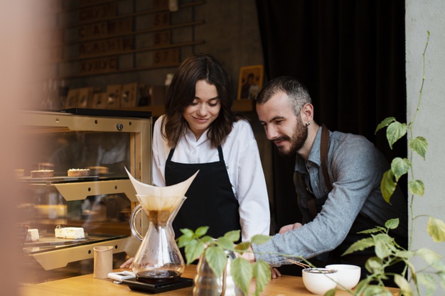 Understanding The Types Of Entrepreneurship: Categories & Features 3 couple aprons looking coffee filter 23 2148366668 1